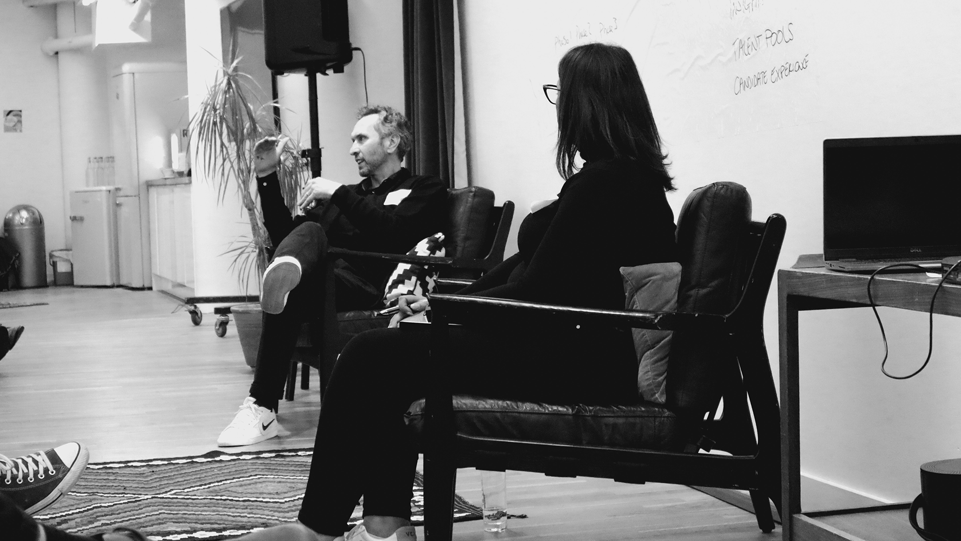 Graeme and Minnie in front of whiteboard at Elevate event