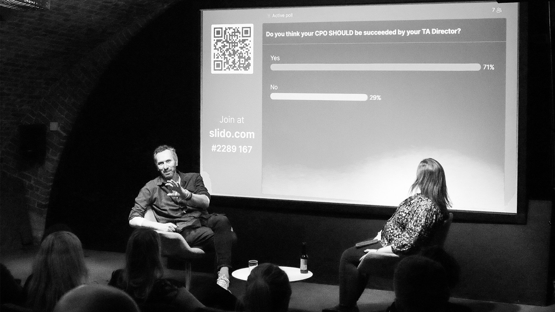 Graeme and Emily sitting in front of presentation-How to engage your CEO with your TA strategy